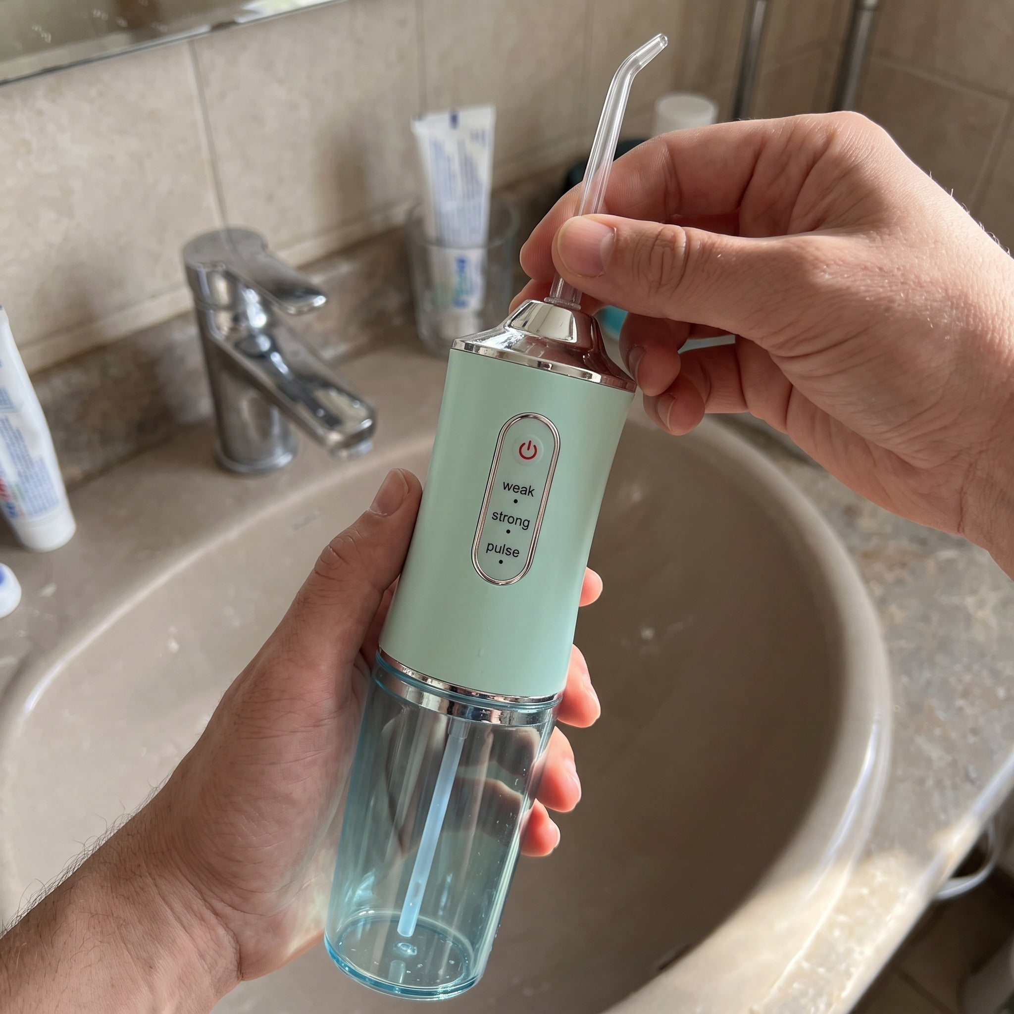 Hand turning the Mint Freshflow nozzle